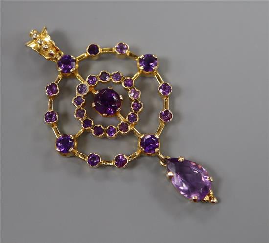 A 1970s Edwardian style 9ct gold and amethyst set openwork drop pendant, overall 55mm.